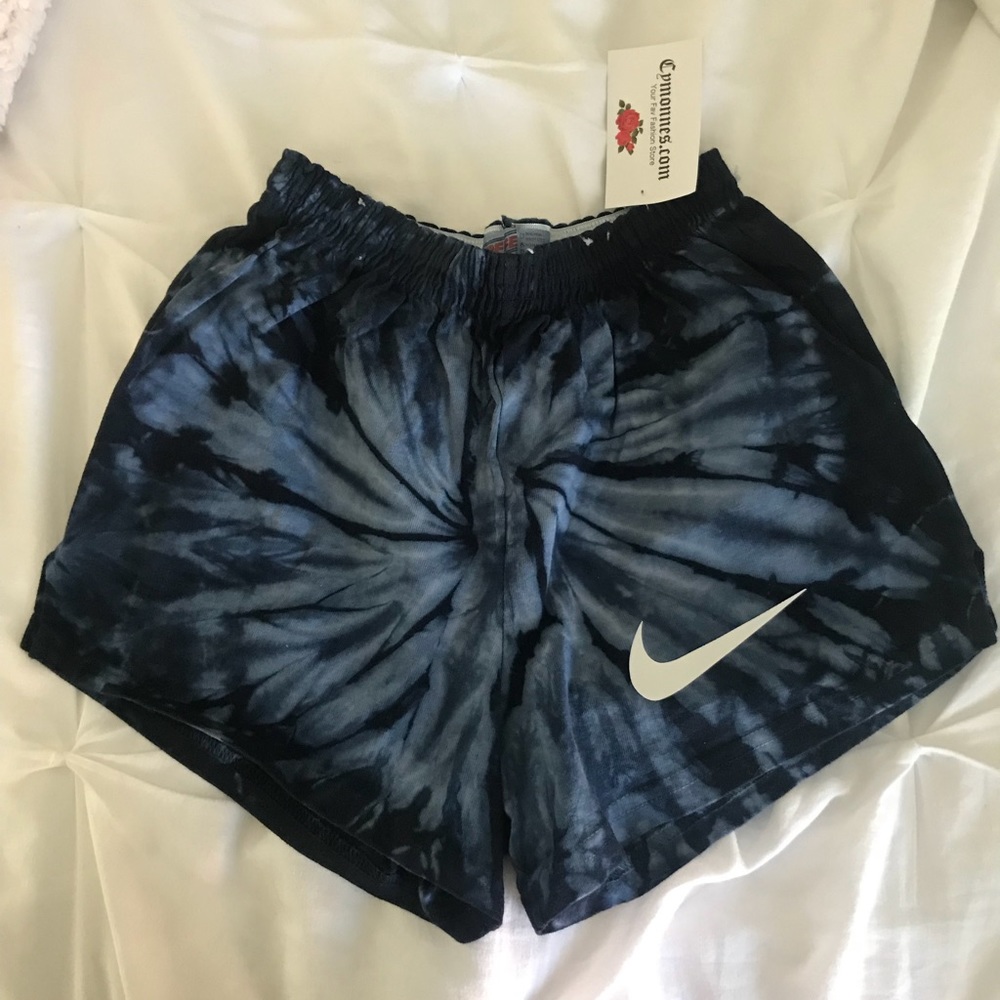 Blue tie-dye shorts with nike symbol